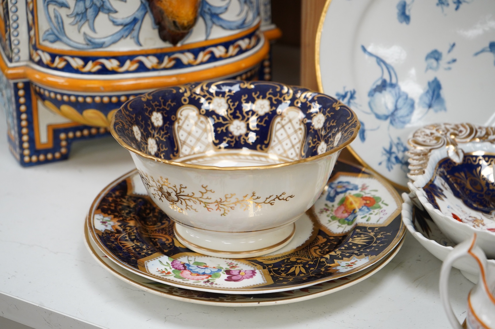 A collection of early 19th century English porcelain tea, dessert and dinner wares including Derby dessert plates, Bloor Derby, Barr Flight & Barr plate, Spode, Coalport etc.